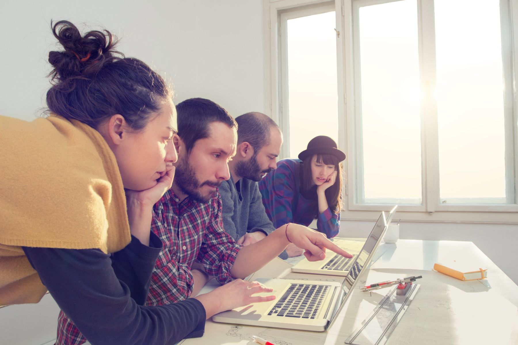 Our team reviewing a website design on a laptop